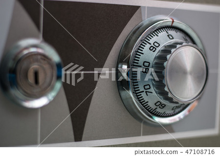 classic combination lock dial on safe box. 47108716