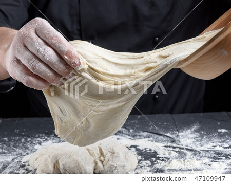 cook kneads white wheat flour dough cook kneads white wheat flour dough 47109947