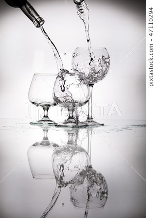 glasses and bottles for brandy and wine in the background glasses and bottles for brandy and wine in the background 47110294