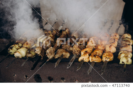 cooking meat skewer barbecue smoke cuisine 47113740