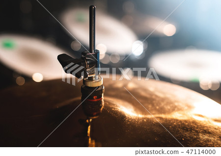 Close-up Drum set in a dark room against the backdrop of the spotlight. Atmospheric background Close-up Drum set in a dark room against the backdrop of the spotlight. Atmospheric background 47114000
