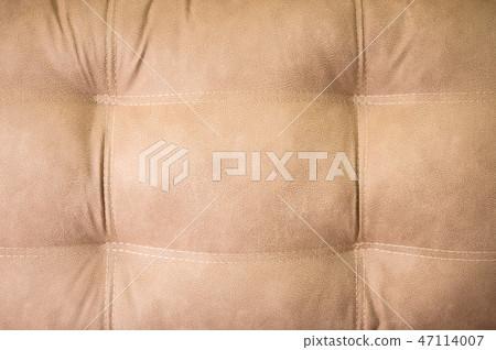 A close-up of a fragment of an expensive beige textile sofa in the room 47114007