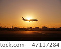 Airplane in sunset 47117284