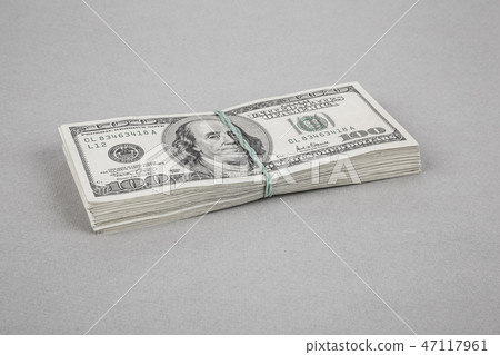 American Dollar stacks on grey American Dollar stacks on grey 47117961