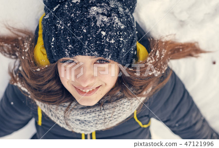 a Beautiful young woman in winter outside 47121996