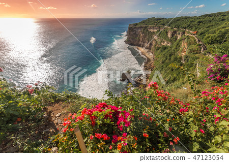 View of Uluwatu cliff with coast and blue ocean in Bali, Indonesia View of Uluwatu cliff with coast and blue ocean in Bali, Indonesia 47123054