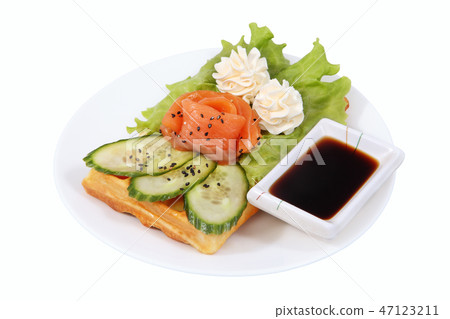 Belgian waffle with smoked salmon, lettuce leaf Belgian waffle with smoked salmon, lettuce leaf 47123211
