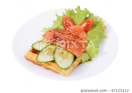 Belgian waffle with sliced salted salmon, tomatoes Belgian waffle with sliced salted salmon, tomatoes 47123212