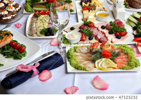 decorated table, with meat and fish specialties. 47123232