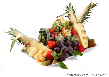 Set of fresh tropical fruit on plate, on white. Set of fresh tropical fruit on plate, on white. 47123244