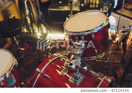Drums conceptual image. Picture of drums and drumsticks lying on snare drum. Retro vintage instagram Drums conceptual image. Picture of drums and drumsticks lying on snare drum. Retro vintage instagram 47124330