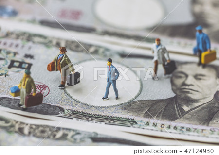 A miniature walking on top of a ten thousand yen bill A miniature walking on top of a ten thousand yen bill 47124930