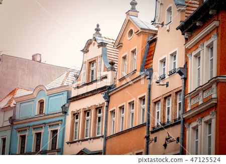 View at roofs and windows of old houses View at roofs and windows of old houses 47125524