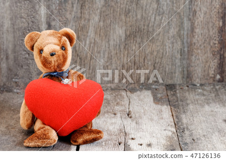 Toy bear doll and the jewelry ring with red heart. Toy bear doll and the jewelry ring with red heart. 47126136