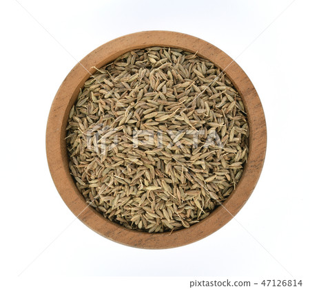 Top view of Caraway seeds in wooden bowl  47126814