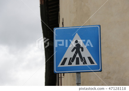 Traffic sign (pedestrian crossing) in San Gimignano, Tuscany, Italy Traffic sign (pedestrian crossing) in San Gimignano, Tuscany, Italy 47128118