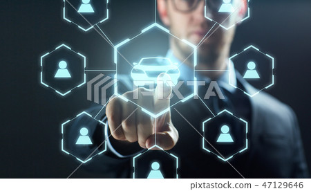 businessman with virtual hologram of car sharing 47129646
