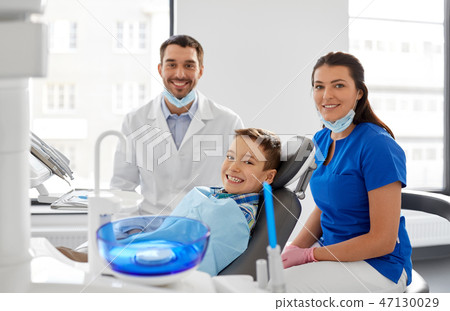 dentists and kid patient at dental clinic dentists and kid patient at dental clinic 47130029