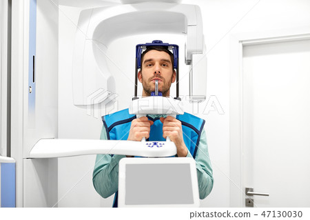 patient having x-ray scanning at dental clinic patient having x-ray scanning at dental clinic 47130030