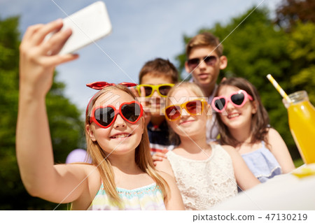 happy kids taking selfie on birthday party happy kids taking selfie on birthday party 47130219