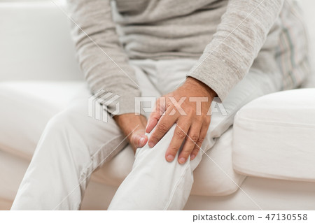 close up of senior man suffering from knee ache close up of senior man suffering from knee ache 47130558