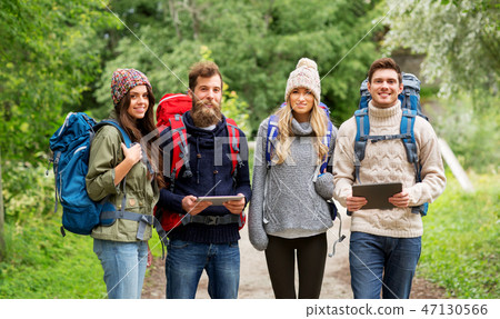 friends or travelers with backpacks and tablet pc friends or travelers with backpacks and tablet pc 47130566