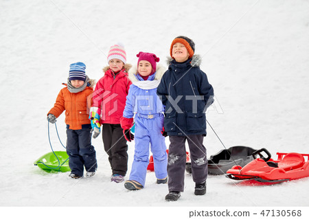 happy little kids with sleds in winter happy little kids with sleds in winter 47130568