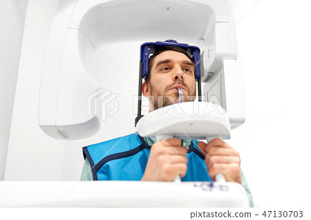 patient having x-ray scanning at dental clinic patient having x-ray scanning at dental clinic 47130703