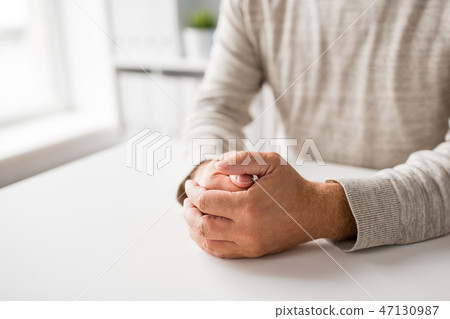 senior man hands on table senior man hands on table 47130987