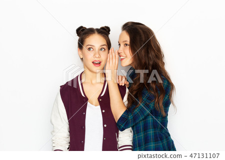 Teenage Girls Gossiping Or Sharing Secrets Stock Photo