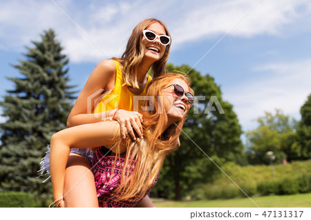 happy teenage girls having fun at summer park happy teenage girls having fun at summer park 47131317