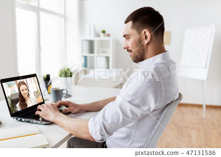 businessman having video call on laptop at office businessman having video call on laptop at office 47131586