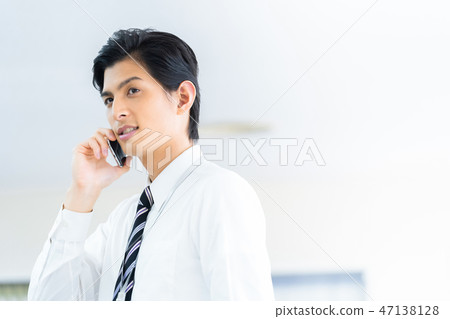 Male employee who calls a young businessman Male employee who calls a young businessman 47138128