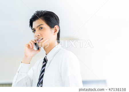 Male employee who calls a young businessman Male employee who calls a young businessman 47138138