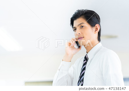 Male employee who calls a young businessman Male employee who calls a young businessman 47138147
