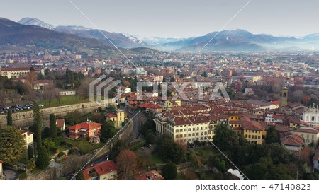Aerial view of Bergamo cityscape and surrounding mountains, Italy 47140823