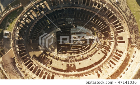 Aerial top down view of crowded Colosseum or Coliseum amphitheatre in Rome, main landmark of the 47141036