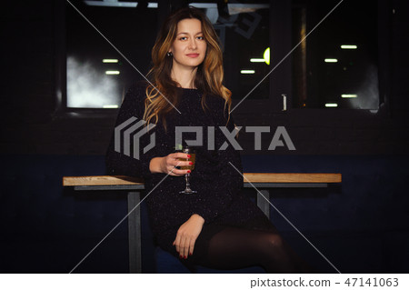 Pretty girl in bar spending time, having cocktail Pretty girl in bar spending time, having cocktail 47141063