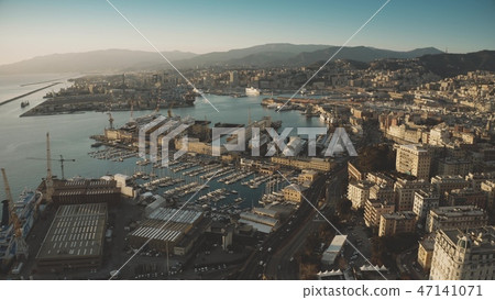 Aerial view of seaport and cityscape of Genoa in the evening, Italy Aerial view of seaport and cityscape of Genoa in the evening, Italy 47141071