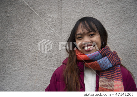 smile young teen woman Asian portrait red coat 47141205
