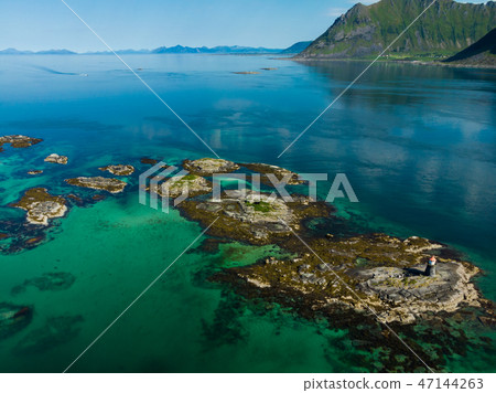 Gimsoy lighthouse on sea rocks, Lofoten Norway 47144263