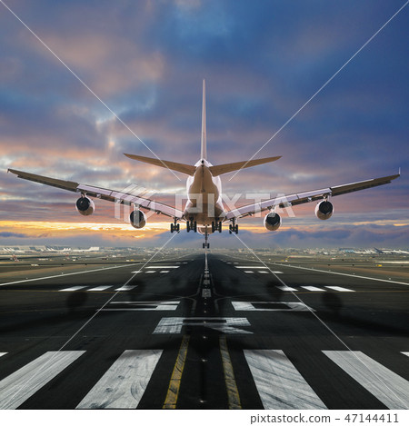 Airplane landing at the airport. Airplane landing at the airport. 47144411