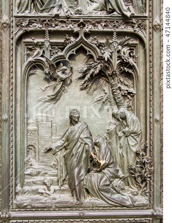 Detail bronze reliefs at Milan's Cathedral door 47144840