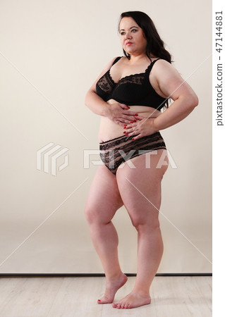 Plus size model wearing black lingerie Plus size model wearing black lingerie 47144881