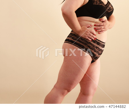 Plus size model wearing black lingerie Plus size model wearing black lingerie 47144882