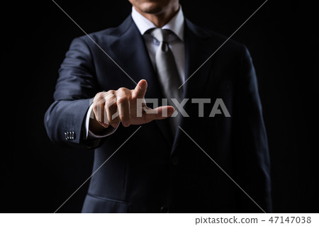 Pointing businessman 47147038