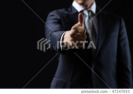 A businessman doing a good sign A businessman doing a good sign 47147055
