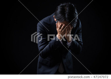 Businessman who is suffering Businessman who is suffering 47147072