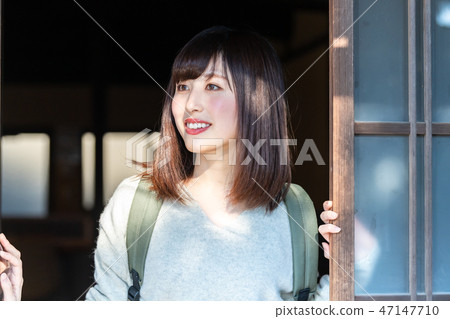 Old private house and a young lady 47147710