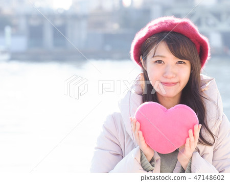 A woman with a pink heart 47148602